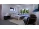 Main bedroom with sliding doors to a pool view at 440 S Lime Ave, Sarasota, FL 34237