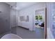 Modern bathroom with double vanity and soaking tub at 440 S Lime Ave, Sarasota, FL 34237