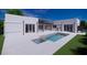 Modern home with a clean, rectangular pool and patio at 440 S Lime Ave, Sarasota, FL 34237