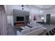 Spacious living room with fireplace and large TV at 440 S Lime Ave, Sarasota, FL 34237