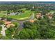Aerial view of community near golf course and water at 4573 Pine Green Trl # 1, Sarasota, FL 34241