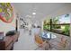 Sunroom with view of kitchen and backyard access at 4573 Pine Green Trl # 1, Sarasota, FL 34241