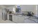 Modern kitchen with granite countertops and stainless steel appliances at 4573 Pine Green Trl # 1, Sarasota, FL 34241