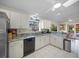 Modern kitchen with granite countertops and stainless steel appliances at 4573 Pine Green Trl # 1, Sarasota, FL 34241