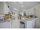 Modern kitchen with granite countertops and stainless steel appliances at 4573 Pine Green Trl # 1, Sarasota, FL 34241
