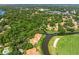 Aerial view of a community with houses, lakes, and golf course at 4573 Pine Green Trl # 1, Sarasota, FL 34241