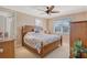 Comfortable bedroom with a double bed and built-in wooden wardrobe at 467 Canal Rd # 467, Sarasota, FL 34242