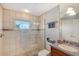Bathroom with walk-in shower, granite vanity, and window at 467 Canal Rd # 467, Sarasota, FL 34242