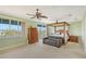 Spacious bedroom with a four-poster bed, sitting area, and water views at 467 Canal Rd # 467, Sarasota, FL 34242