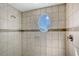 Spacious shower with an oval window offering scenic views at 467 Canal Rd # 467, Sarasota, FL 34242