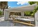 Covered picnic tables and benches under a pavilion at 467 Canal Rd # 467, Sarasota, FL 34242