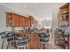 Spacious kitchen with wood cabinets, granite countertops, modern appliances, and barstool seating at 467 Canal Rd # 467, Sarasota, FL 34242