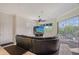 Living room showcasing a large sectional sofa, fireplace, and a sliding glass door leading to a balcony at 467 Canal Rd # 467, Sarasota, FL 34242