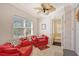 Cozy office space with bright red sofas, a ceiling fan, and a window with blinds at 467 Canal Rd # 467, Sarasota, FL 34242