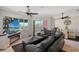 Living room features a sectional sofa, large TV, and water views at 467 Canal Rd # 467, Sarasota, FL 34242
