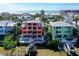 Aerial view of colorful waterfront homes with boats and a pool at 467 Canal Rd # 467, Sarasota, FL 34242