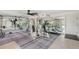 Private home gym with various equipment and mirrors at 467 Canal Rd # 467, Sarasota, FL 34242
