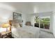 Cozy bedroom with a queen-size bed, access to a patio, and a tranquil atmosphere at 4817 Sarasota Ave, Sarasota, FL 34234