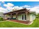 Large covered patio with pergola and built-in seating at 4817 Sarasota Ave, Sarasota, FL 34234