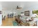 Spacious living room with an open floor plan, view into kitchen, and hardwood flooring at 4817 Sarasota Ave, Sarasota, FL 34234