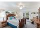 Primary bedroom with a wooden bed frame, and access to backyard patio at 4817 Sarasota Ave, Sarasota, FL 34234
