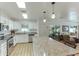 Bright kitchen features granite countertops and white cabinets at 4817 Sarasota Ave, Sarasota, FL 34234