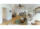 Open and bright living room showcasing an open floor plan, hardwood floors, and ceiling fan at 4817 Sarasota Ave, Sarasota, FL 34234
