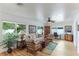 Relaxing living room featuring a comfortable sofa and armchairs, hardwood floors, and ample natural light at 4817 Sarasota Ave, Sarasota, FL 34234