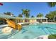 Resort-style pool with a unique wooden slide, perfect for relaxing or playing at 7819 Ashley Cir, Bradenton, FL 34201