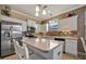 Modern kitchen featuring stainless steel appliances and white cabinetry at 8019 Haven Harbour Way, Bradenton, FL 34212