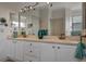 Bathroom with double vanity and large mirror at 8019 Haven Harbour Way, Bradenton, FL 34212