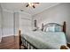 Well-lit bedroom with double doors and wood floors at 8019 Haven Harbour Way, Bradenton, FL 34212