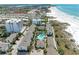 Aerial view of community, pool, and beach access at 1048 W Peppertree Ln # 118B, Sarasota, FL 34242