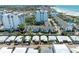 Aerial view showing property's location near beach and other buildings at 1048 W Peppertree Ln # 118B, Sarasota, FL 34242