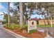 Palms of Manasota community entrance with lush landscaping and signage at 106 49Th E Ct, Palmetto, FL 34221