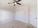 Bedroom with double doors and ceiling fan at 11322 78Th E St, Parrish, FL 34219