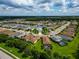 Aerial view of a house in a residential neighborhood near a lake at 12715 Coastal Breeze Way, Bradenton, FL 34211