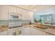 Kitchen with granite countertops and stainless steel sink at 1328 Siesta Bayside Dr # 1328-C, Sarasota, FL 34242