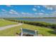 Scenic waterfront view with a bench, offering tranquility and natural beauty at 1328 Siesta Bayside Dr # 1328-C, Sarasota, FL 34242