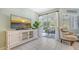 Relaxing living area with patio access and coastal decor at 1328 Siesta Bayside Dr # 1328-C, Sarasota, FL 34242