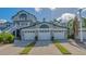 Two-story house with a double garage and lush landscaping at 1328 Siesta Bayside Dr # 1328-C, Sarasota, FL 34242