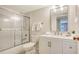 Updated bathroom with white vanity and shower/tub combo at 1328 Siesta Bayside Dr # 1328-C, Sarasota, FL 34242