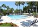 Refreshing community pool with lounge chairs at 1328 Siesta Bayside Dr # 1328-C, Sarasota, FL 34242