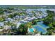 Aerial view of community, tennis courts, and pool at 1328 Siesta Bayside Dr # 1328-C, Sarasota, FL 34242