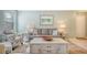 Living room with gray sofa and coastal decor at 1328 Siesta Bayside Dr # 1328-C, Sarasota, FL 34242
