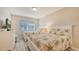 Guest bedroom with two twin beds and updated flooring at 1328 Siesta Bayside Dr # 1328-C, Sarasota, FL 34242