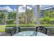 View from screened porch shows a tranquil community landscape at 1328 Siesta Bayside Dr # 1328-C, Sarasota, FL 34242