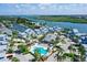 Aerial view of waterfront community with pool and lush landscaping at 1328 Siesta Bayside Dr # 1328-C, Sarasota, FL 34242