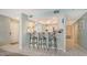Kitchen with granite countertop and breakfast bar at 1328 Siesta Bayside Dr # 1328-C, Sarasota, FL 34242