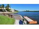 Private dock with seating and waterway access at 1328 Siesta Bayside Dr # 1328-C, Sarasota, FL 34242